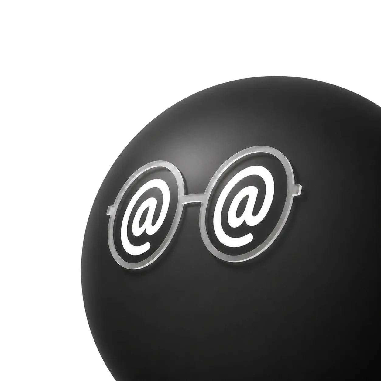 The original logo reference: a cropped black sphere with translucent round glasses and white at-sign eyes.